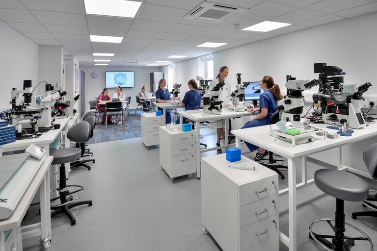 Care Fertility Manchester IVF training lab with trainees 