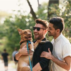 gay males take their dog for a walk