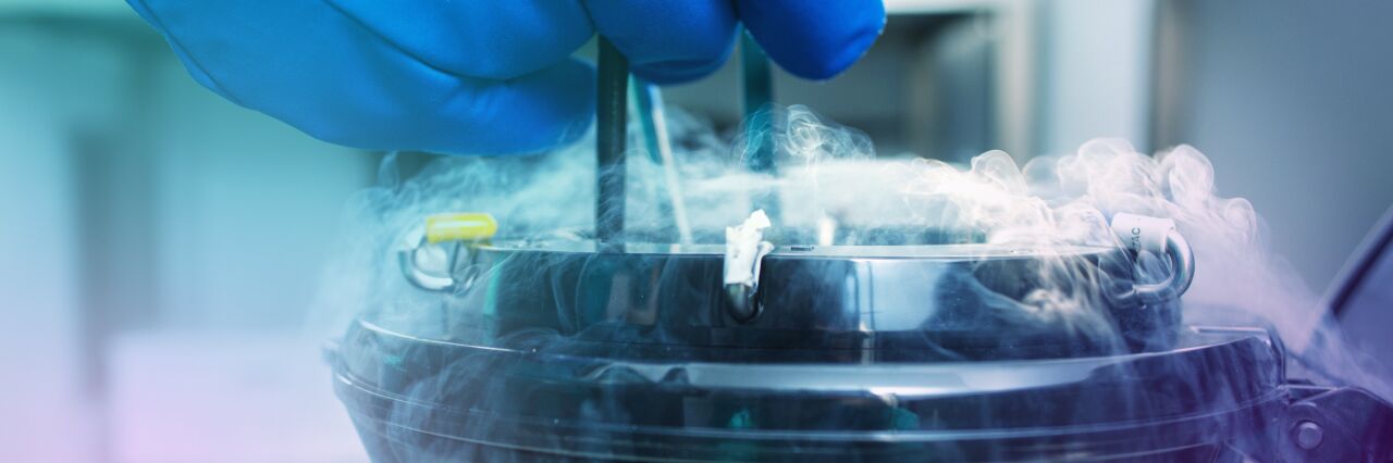 liquid nitrogen tank with blue gloved hand 